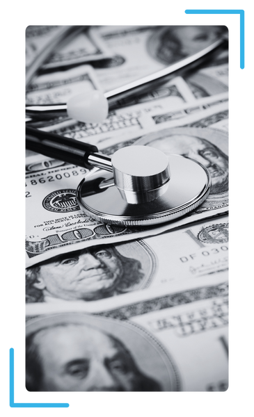 100 dollar bill with prescription pills on top