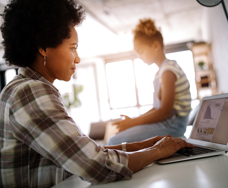 child looking for attention from busy working parents