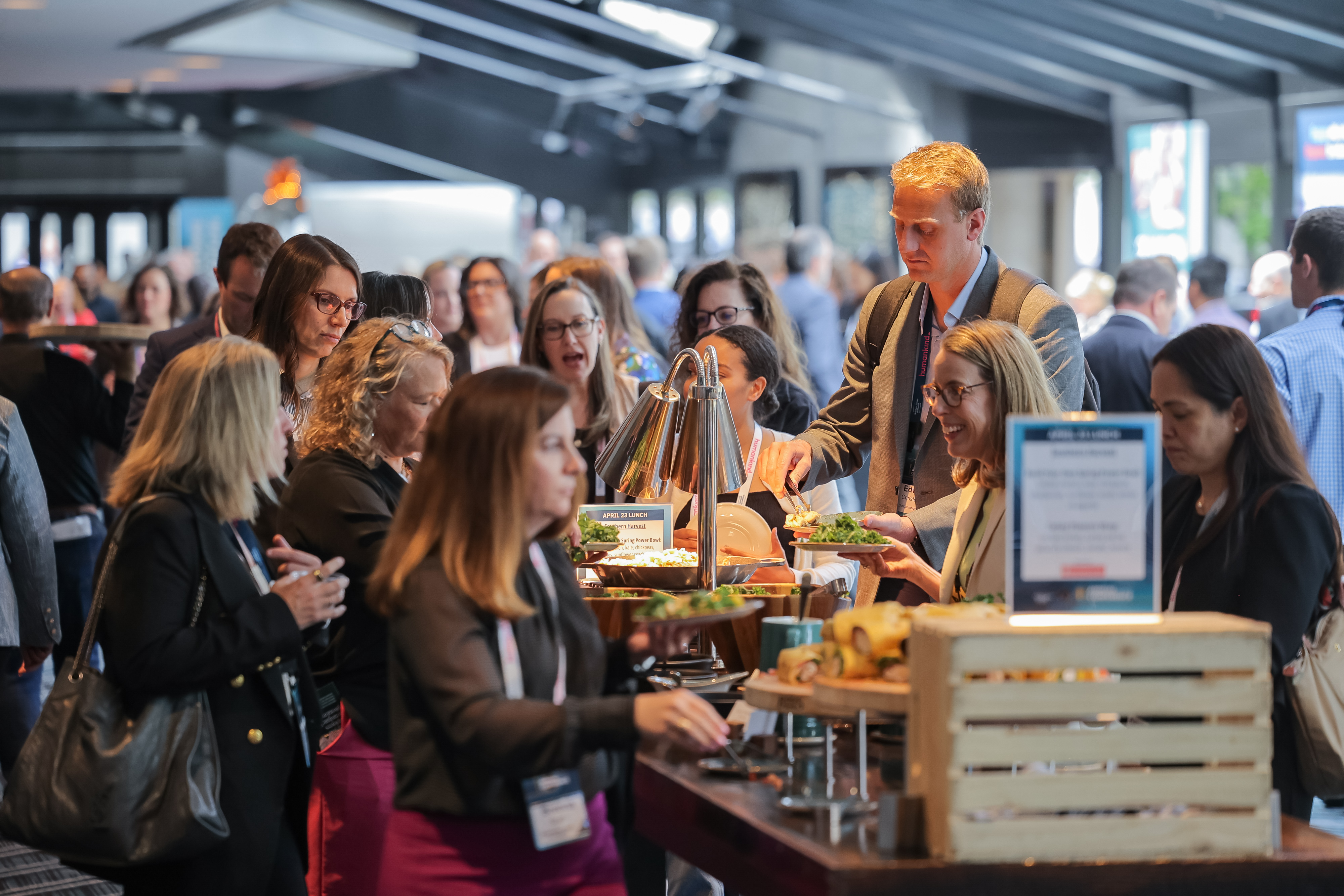 Conference attendees in line at a buffet lunch 